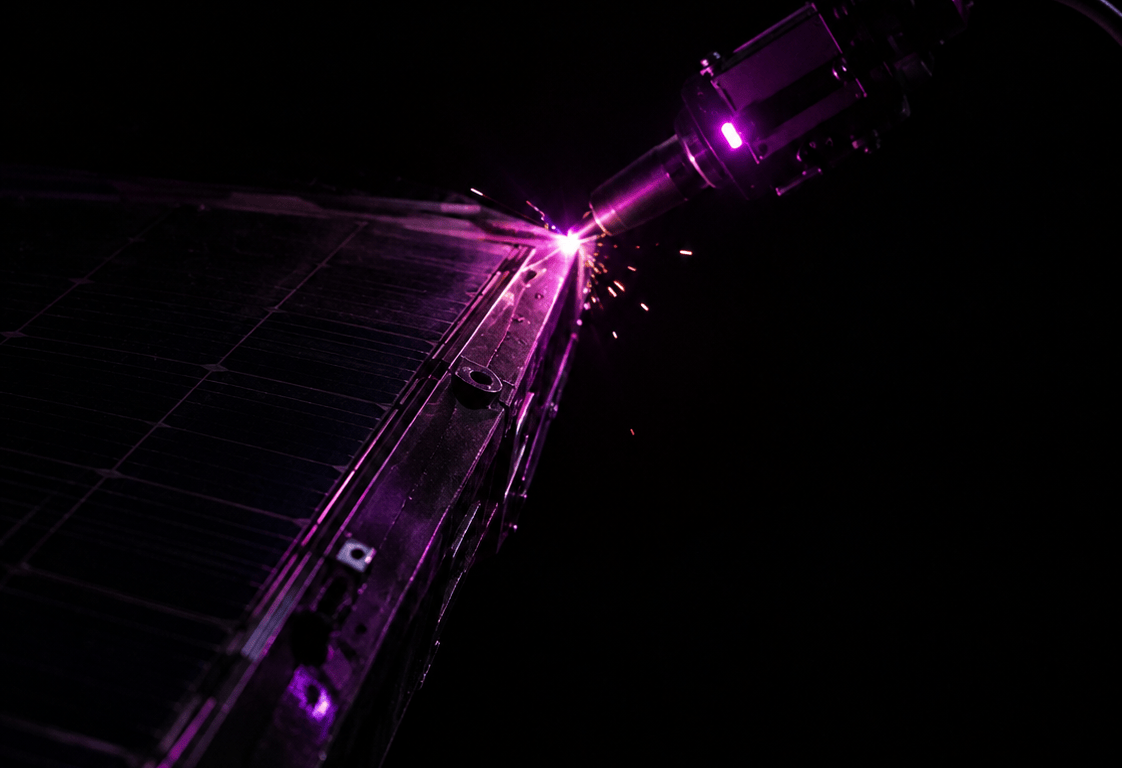 A robotic arm fitted with a compact electron-beam welding tool repairs the hull of a damaged satellite, backlit by low golden sunlight with Earth visible below.