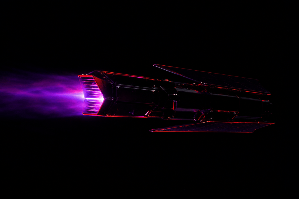 A small very-low-orbit satellite seen edge-on in darkness, its leading-edge air intake glowing magenta and violet with ionised plasma trailing behind.